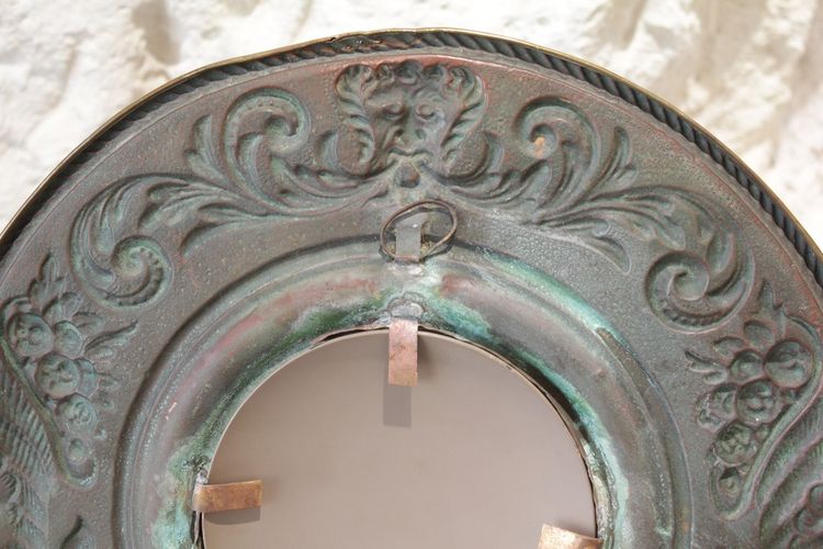Pair of late 19th century embossed brass witch mirrors