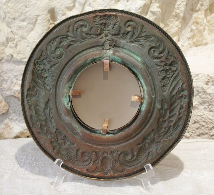 Pair of late 19th century embossed brass witch mirrors