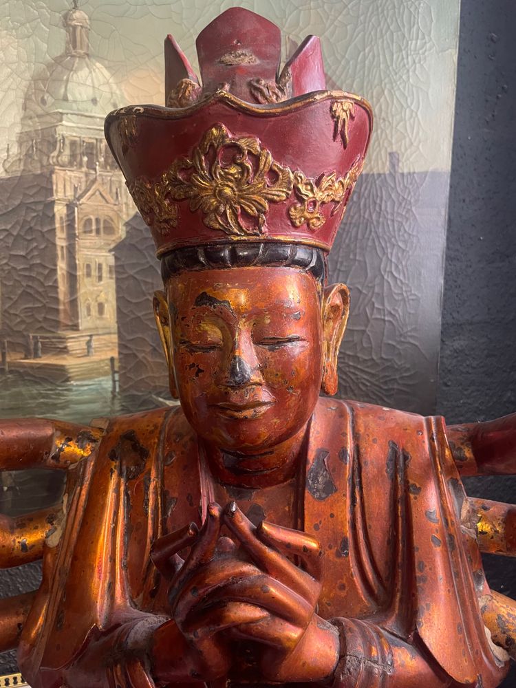 Vietnamese statue representing Quan Am in red and gilded wood