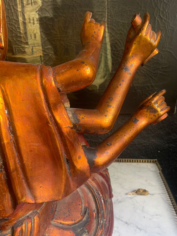 Vietnamese statue representing Quan Am in red and gilded wood