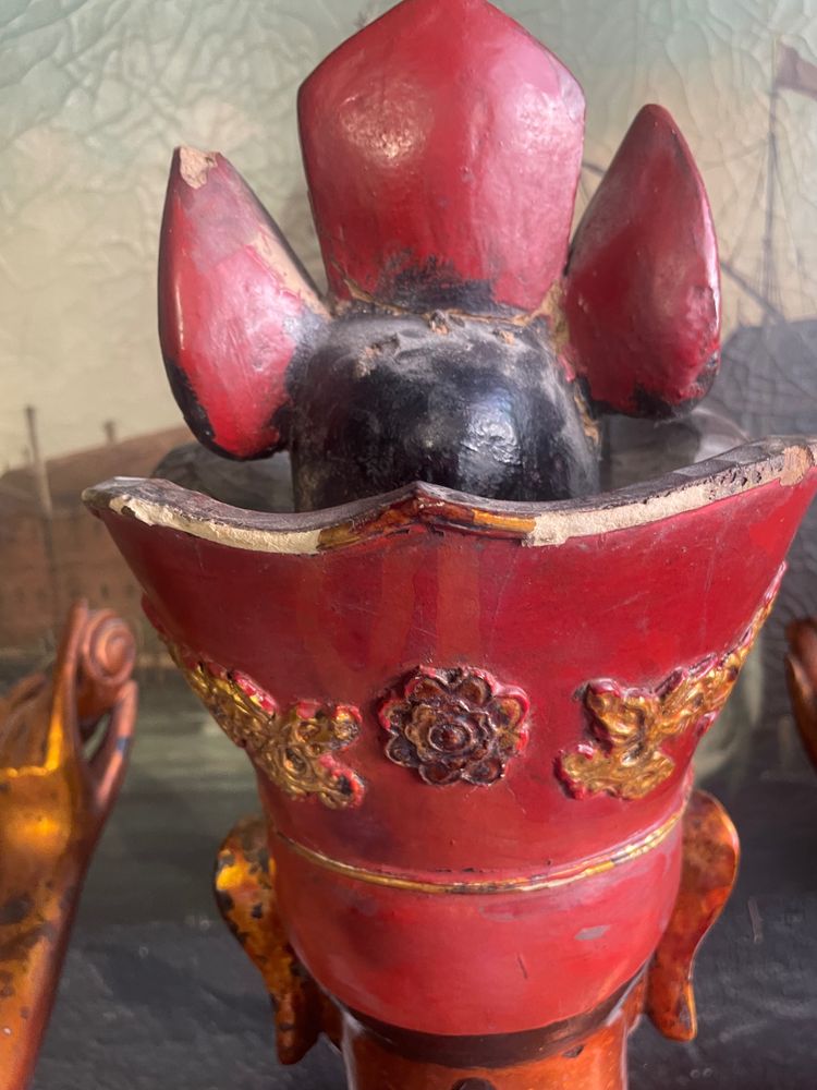 Vietnamese statue representing Quan Am in red and gilded wood
