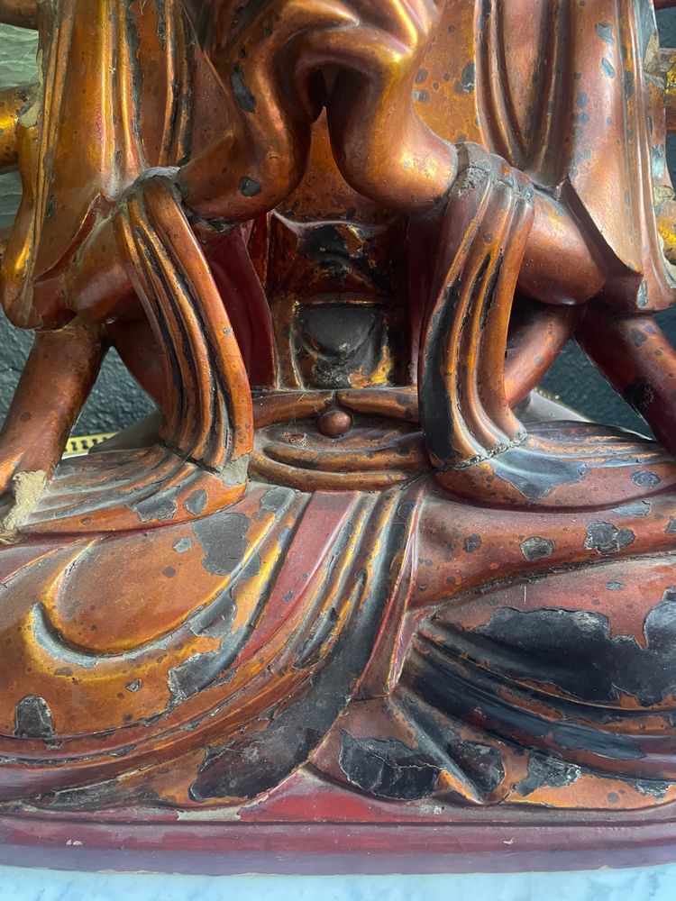 Vietnamese statue representing Quan Am in red and gilded wood
