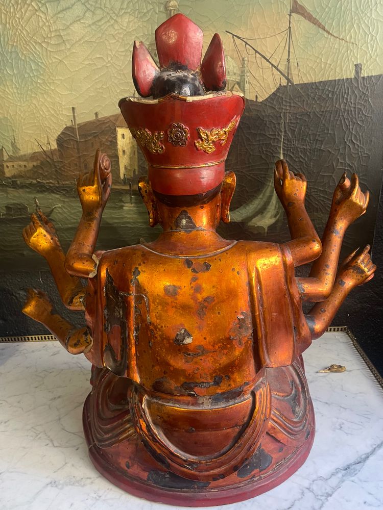 Vietnamese statue representing Quan Am in red and gilded wood