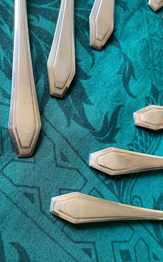 12 art deco teaspoons.