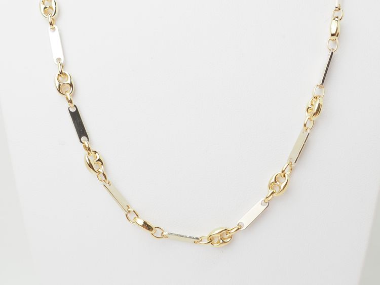 Collana con chicchi di caffè in oro giallo e bianco