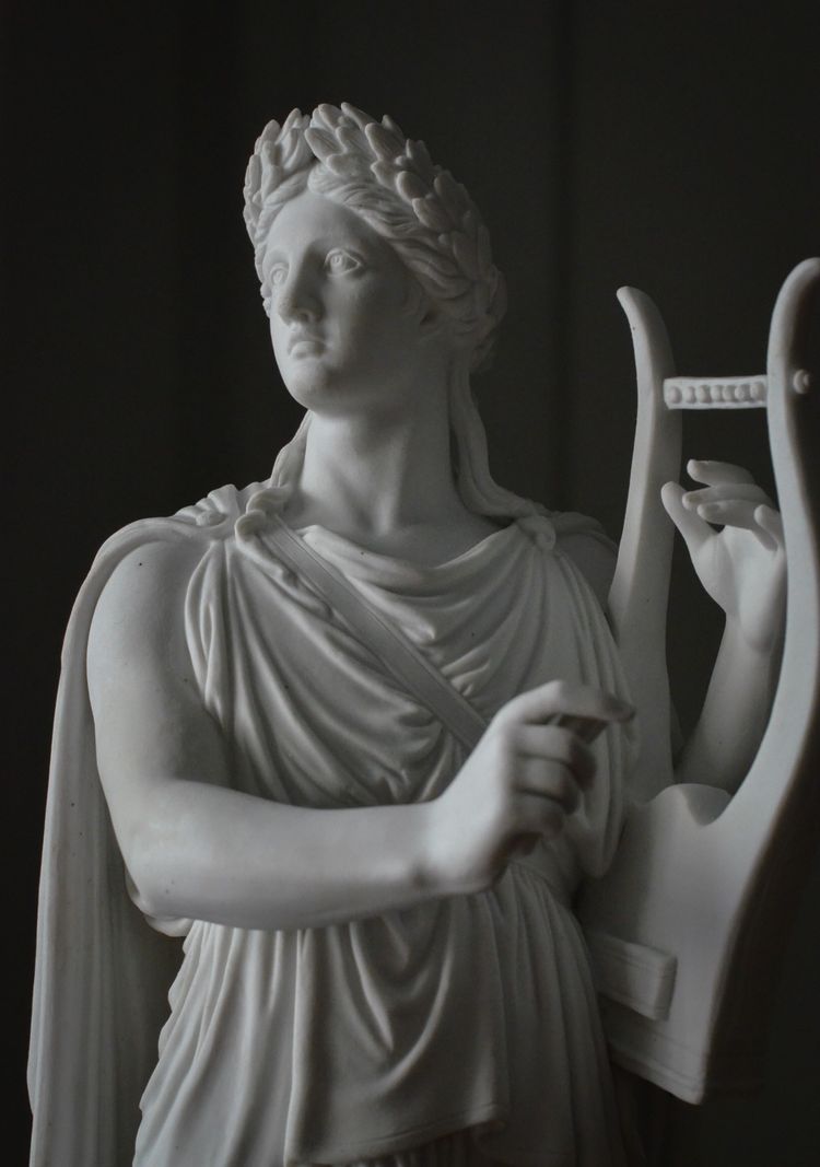 Pair of neoclassical biscuit statuettes
