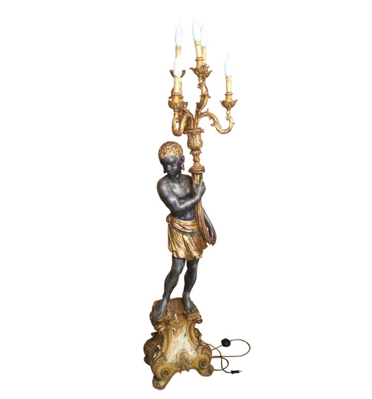 A large "Nubian" floor lamp in the Italian Baroque style, in painted and gilded wood.