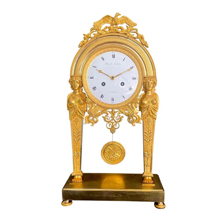 ManteL CLOCK with chiseled and gilded bronze caryatids, empire period