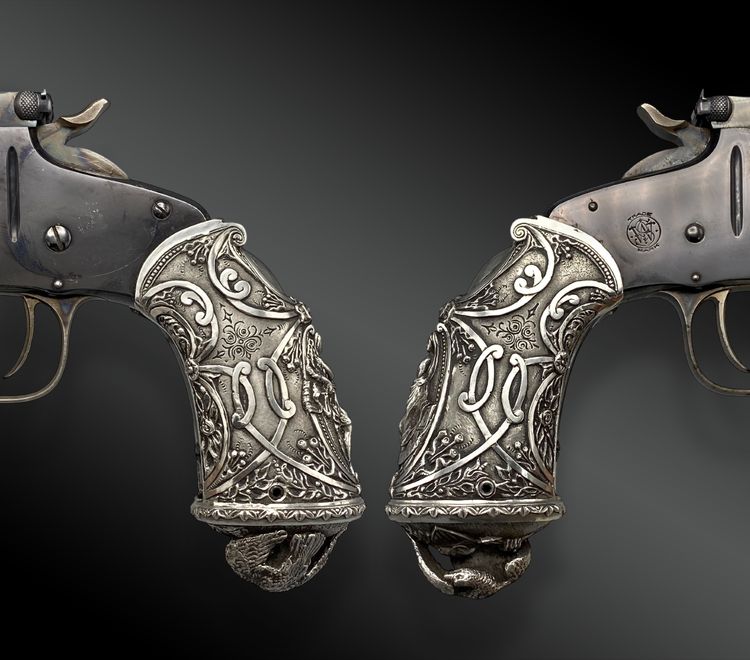 PISTOLA A COLPO SINGOLO SMITH & WESSON, 2 Mod. CALCIO LIBERTY ALLEGORIA.