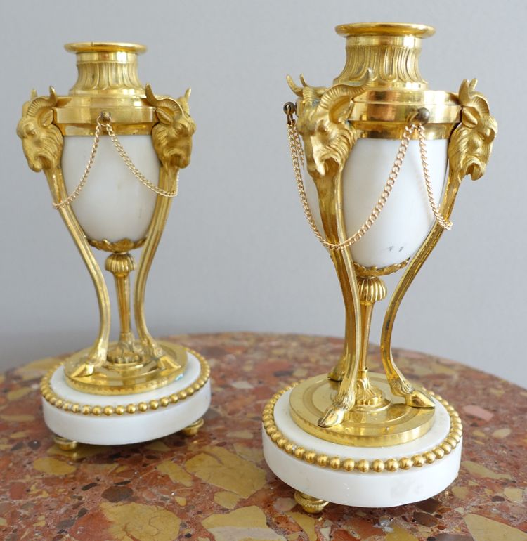 Pair of Louis XVI style marble ormolu cassolettes with upside-down candlesticks