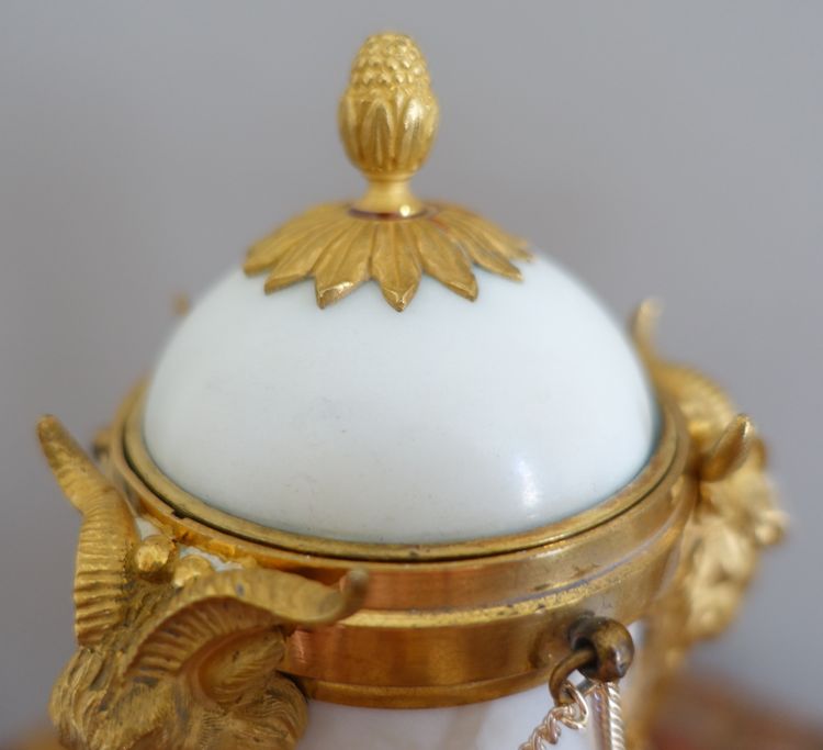 Pair of Louis XVI style marble ormolu cassolettes with upside-down candlesticks