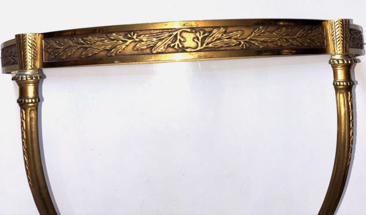 Louis XVI style floating half-moon console with marble top and chased brass structure