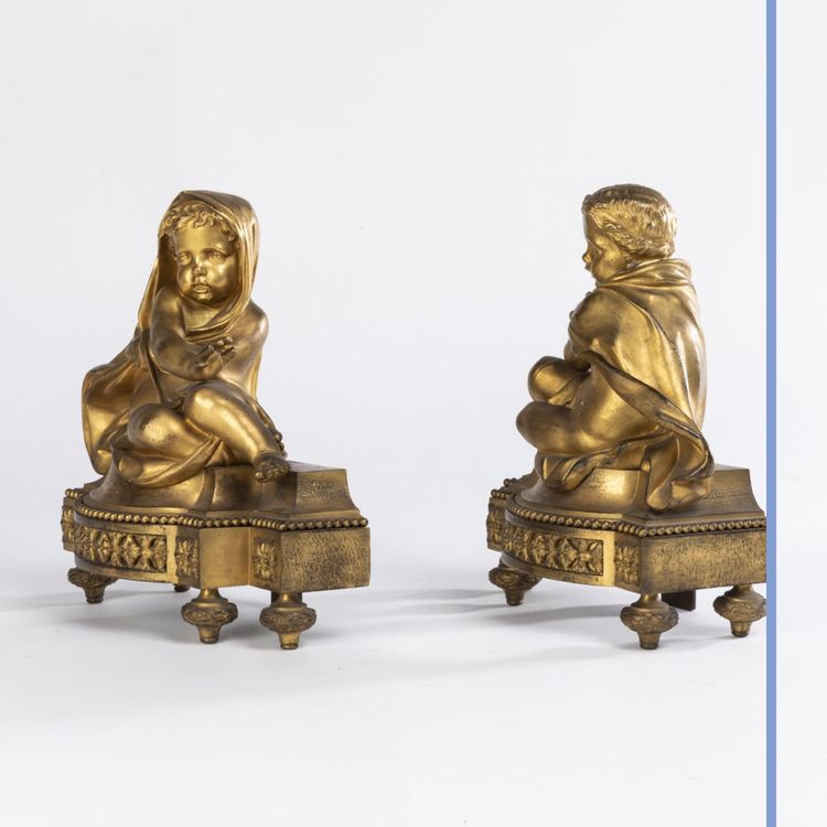 Pair of small ormolu andirons with putti, 19th century