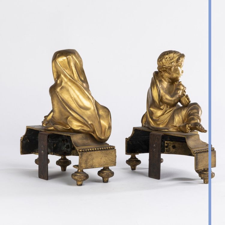 Pair of small ormolu andirons with putti, 19th century