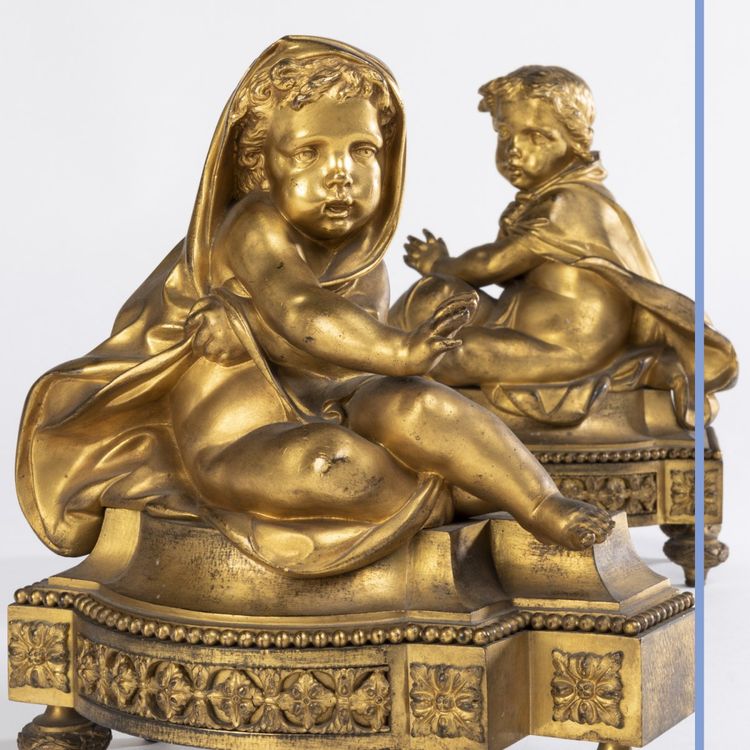 Pair of small ormolu andirons with putti, 19th century