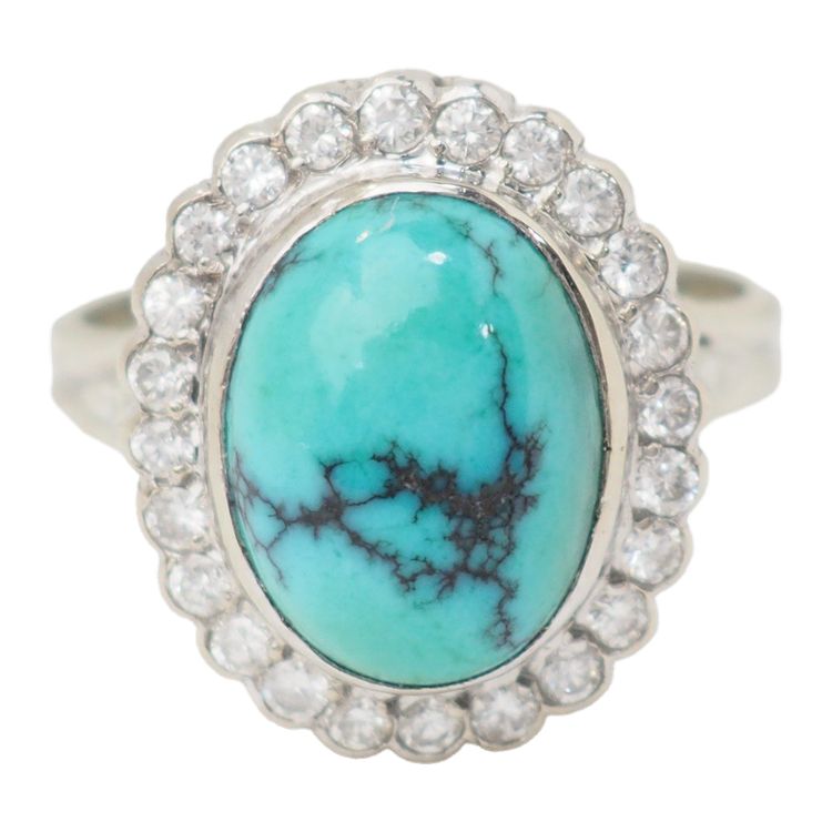 Anello con contorno in oro bianco, diamanti e turchese cabochon