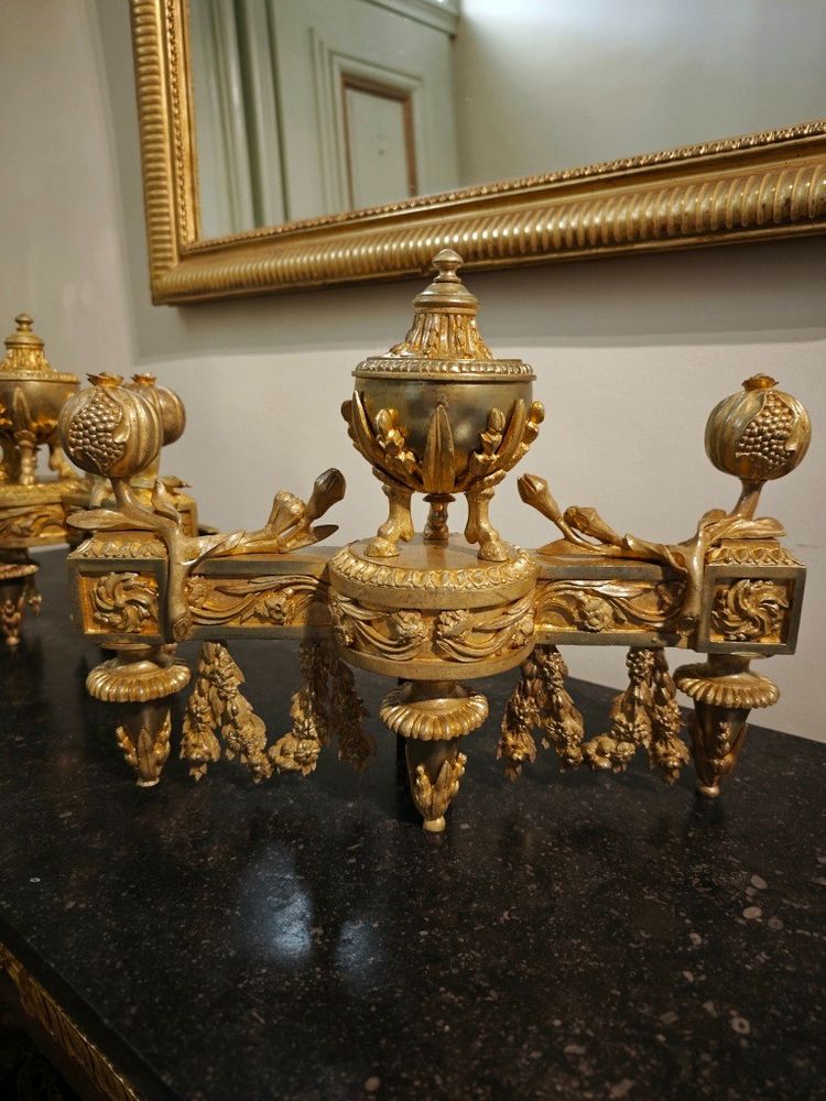 Pair of gilt bronze Chenets with Antique style Pots in the Louis XVI style 19th century