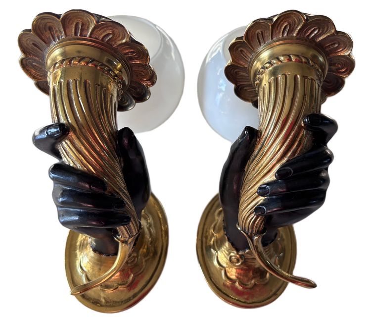 JANSEN Pair of bronze sconces depicting a Nubian hand holding a cornucopia