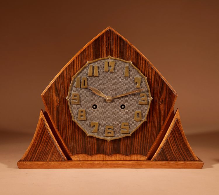 Exceptional and very elegant mantel clock, typical of the Amsterdam Art Deco school, in oak.