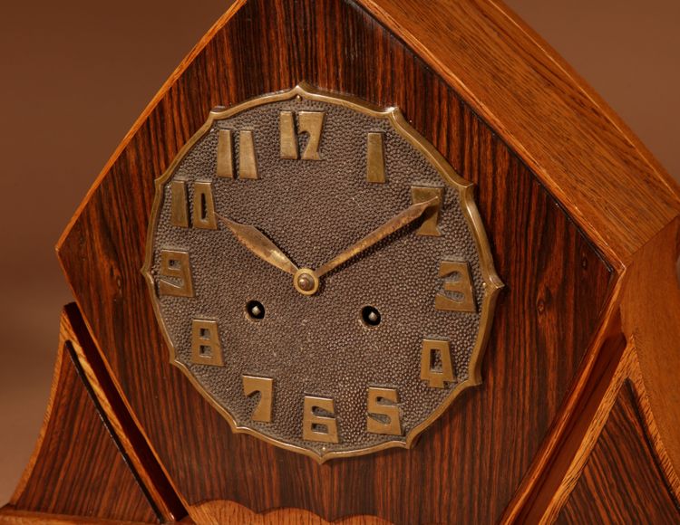Exceptional and very elegant mantel clock, typical of the Amsterdam Art Deco school, in oak.