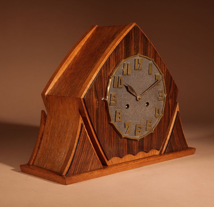 Exceptional and very elegant mantel clock, typical of the Amsterdam Art Deco school, in oak.