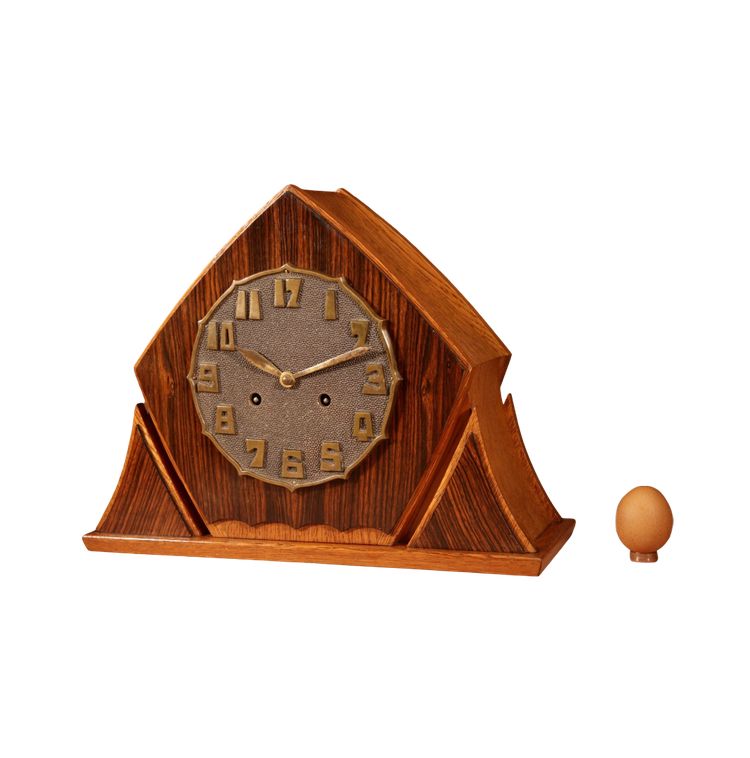 Exceptional and very elegant mantel clock, typical of the Amsterdam Art Deco school, in oak.