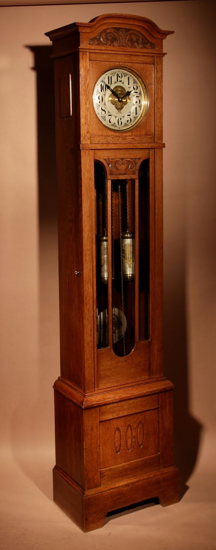 Impressive, magnificent Art Deco Dutch parquet clock in gilded oak.