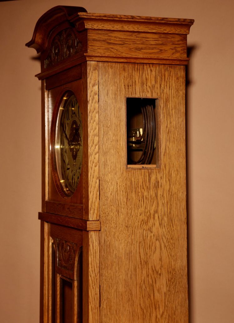 Impressive, magnificent Art Deco Dutch parquet clock in gilded oak.