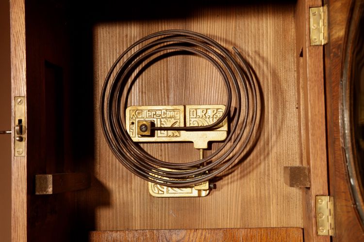 Impressive, magnificent Art Deco Dutch parquet clock in gilded oak.