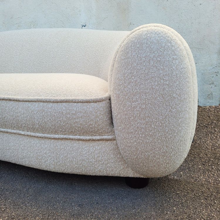 In the style of J Royère, polar bear sofa