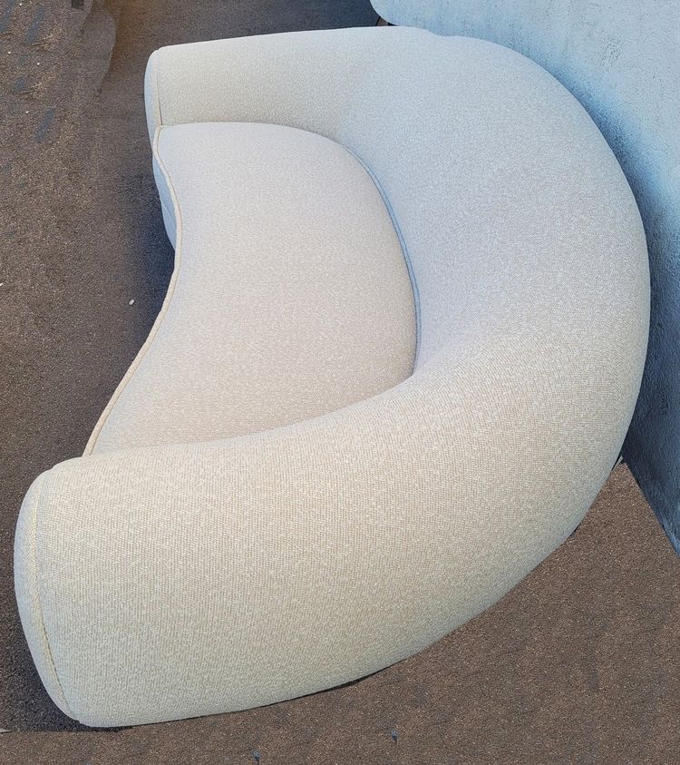 In the style of J Royère, polar bear sofa