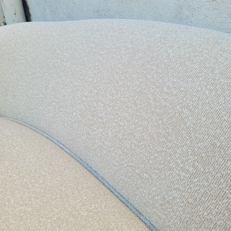 In the style of J Royère, polar bear sofa
