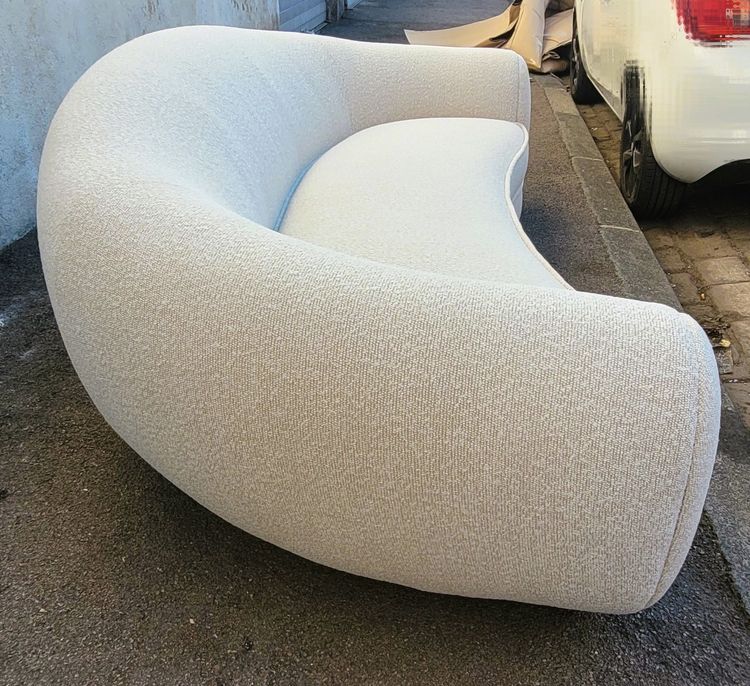 In the style of J Royère, polar bear sofa