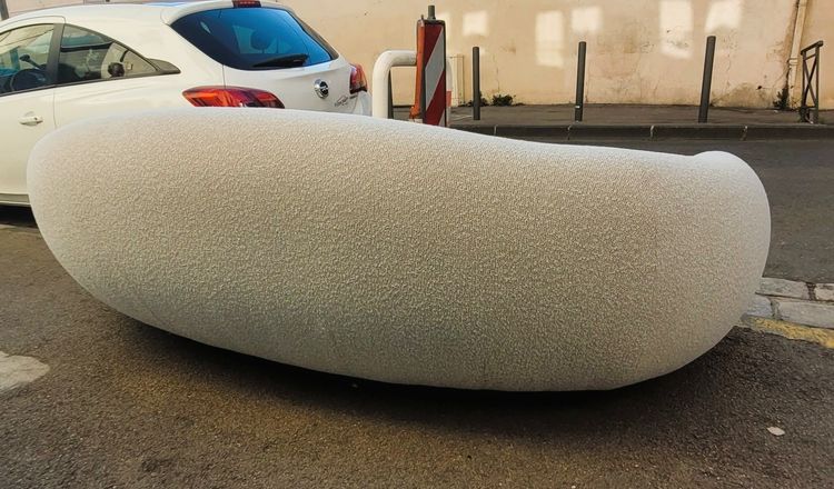 In the style of J Royère, polar bear sofa