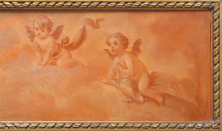 Painted wooden trumeau topped with an oil on panel with cherubs