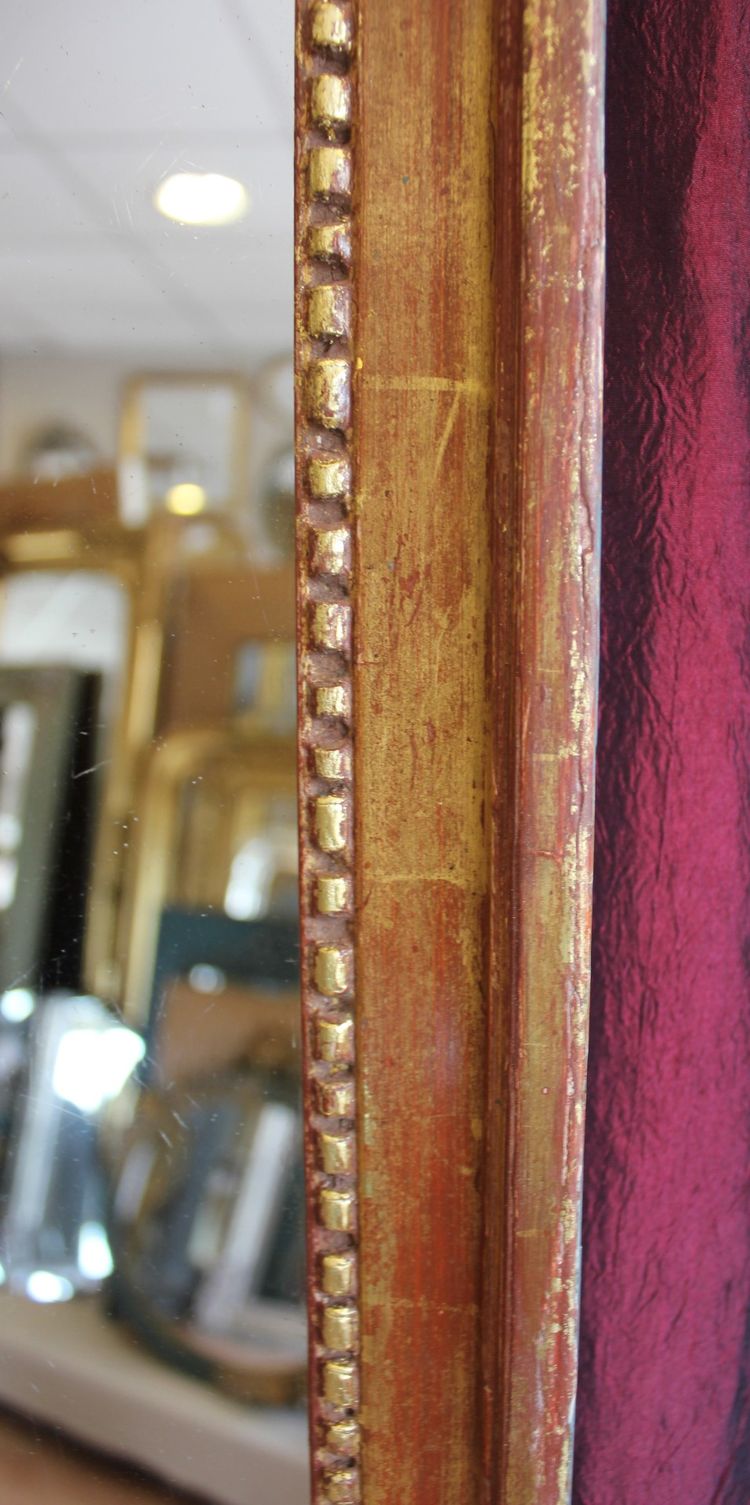 69 x 123 cm Louis XVI mirror, 18th century, carved and gilded wood