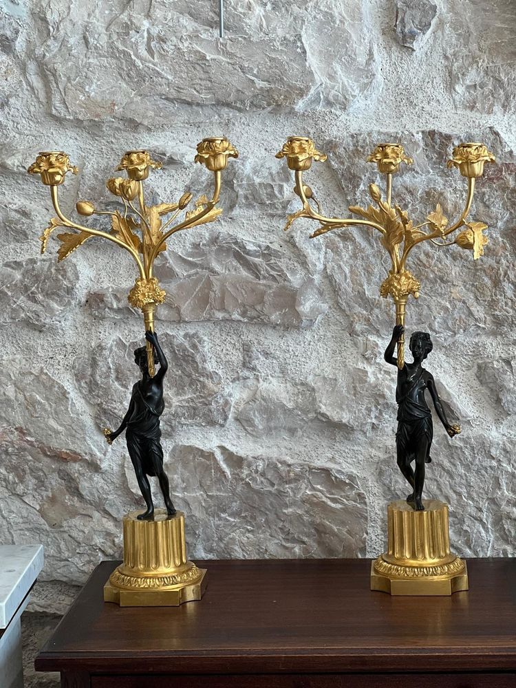 Paire de candélabres en bronze patiné et bronze doré, début du XIXème siècle.