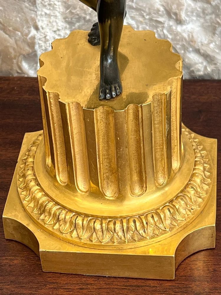 Paire de candélabres en bronze patiné et bronze doré, début du XIXème siècle.