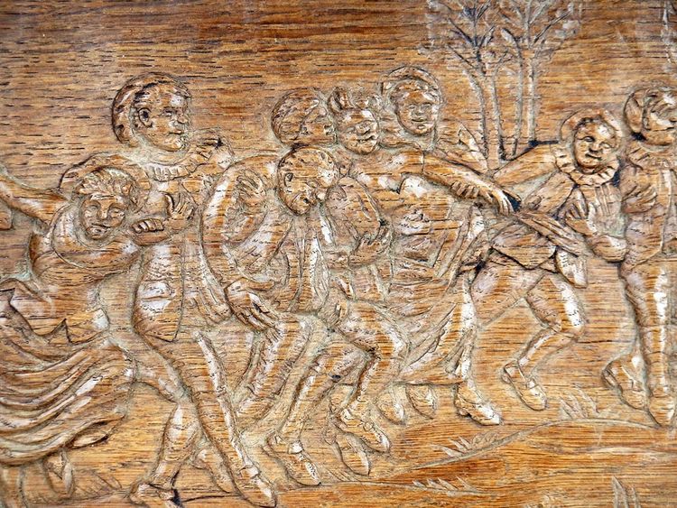 "Scena di festa" Pannello in legno intagliato
