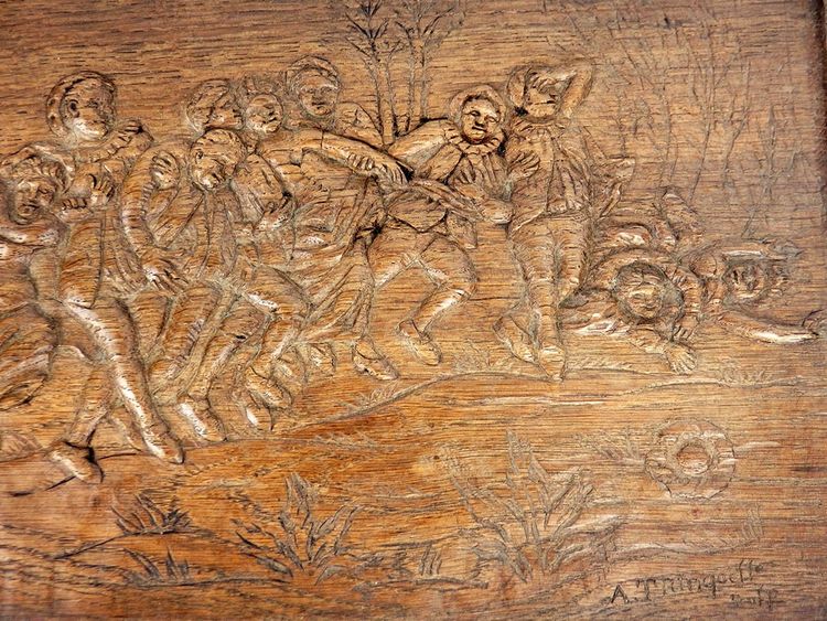 "Scena di festa" Pannello in legno intagliato