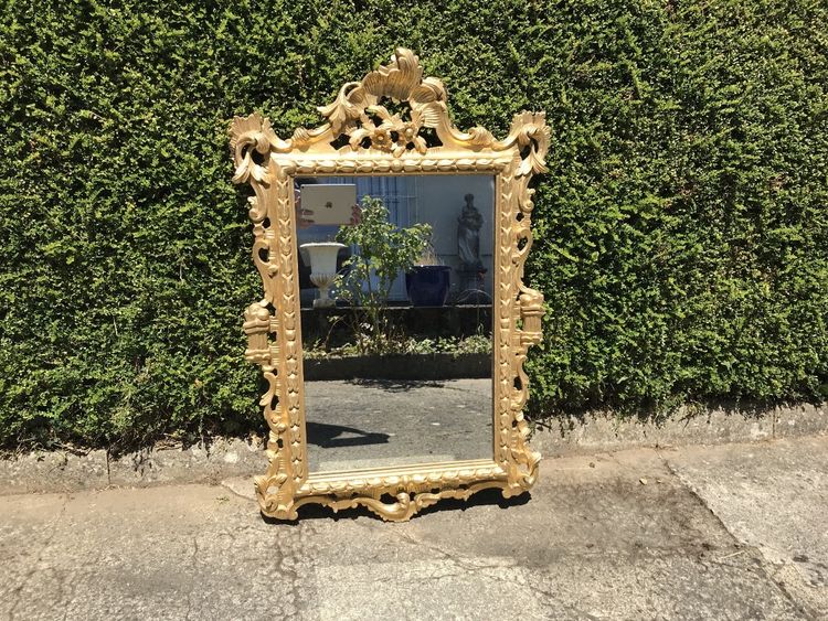 Antique Louis XV style gilded wood mirror from the 20th century