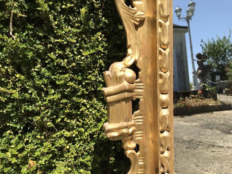 Antique Louis XV style gilded wood mirror from the 20th century