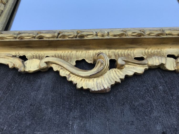 Antique Louis XV style gilded wood mirror from the 20th century