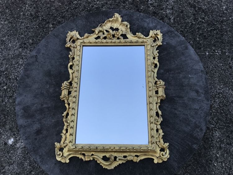 Antique Louis XV style gilded wood mirror from the 20th century