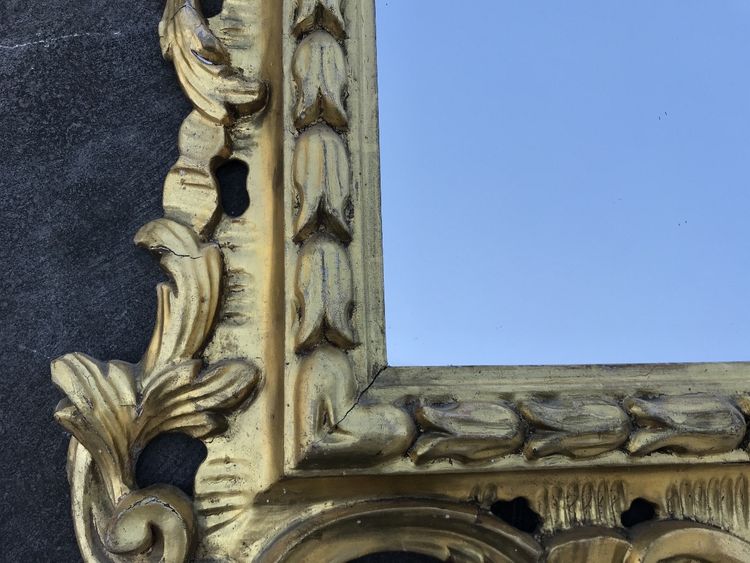 Antique Louis XV style gilded wood mirror from the 20th century