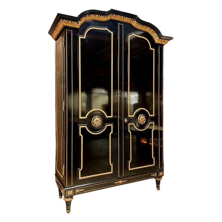 Large wardrobe in blackened and gilded wood