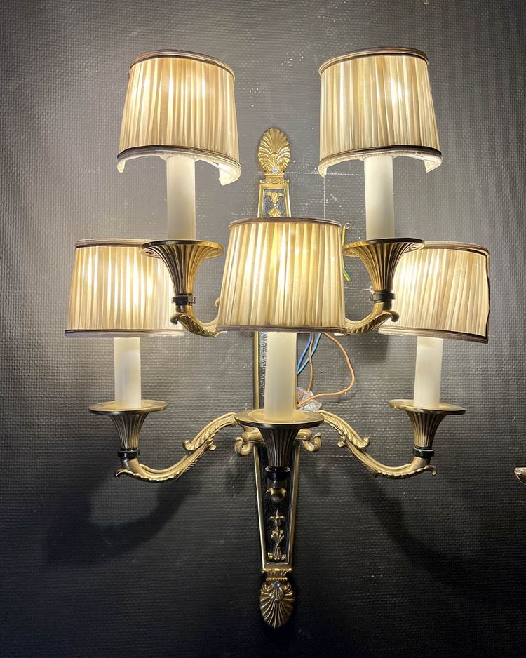 Pair of patinated bronze and gilt bronze wall lights with five arms