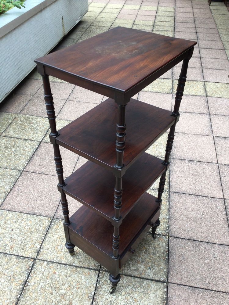 A shelf that can be used as a bookcase or a serving trolley