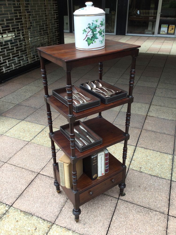 A shelf that can be used as a bookcase or a serving trolley