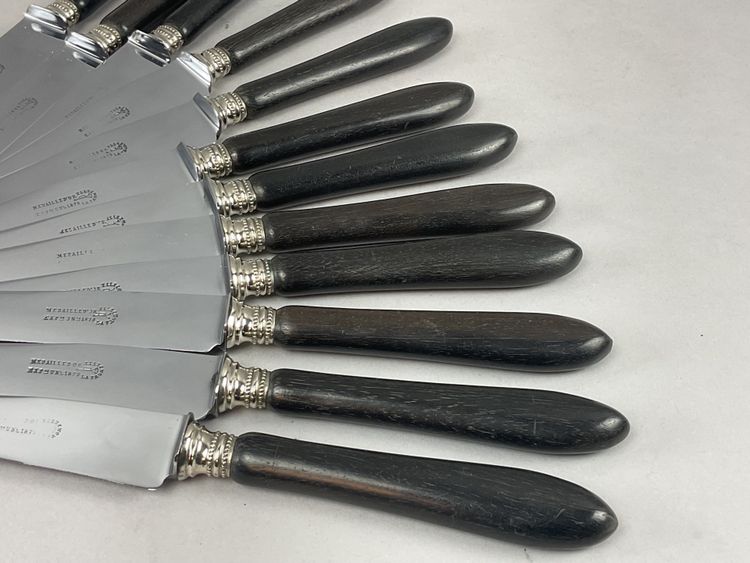 12 table knives with ebony handles and pearl decoration